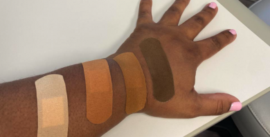 Image of an arm with four different flesh-toned bandages